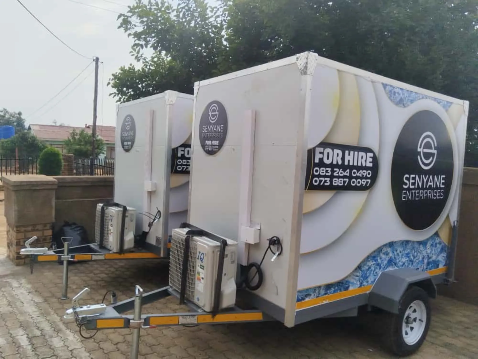 Two Senyane Enterprises freezer trailers parked, ready for hire